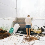 Farm life tips for an organized backyard work area with tools, baskets, and a ready garden workspace