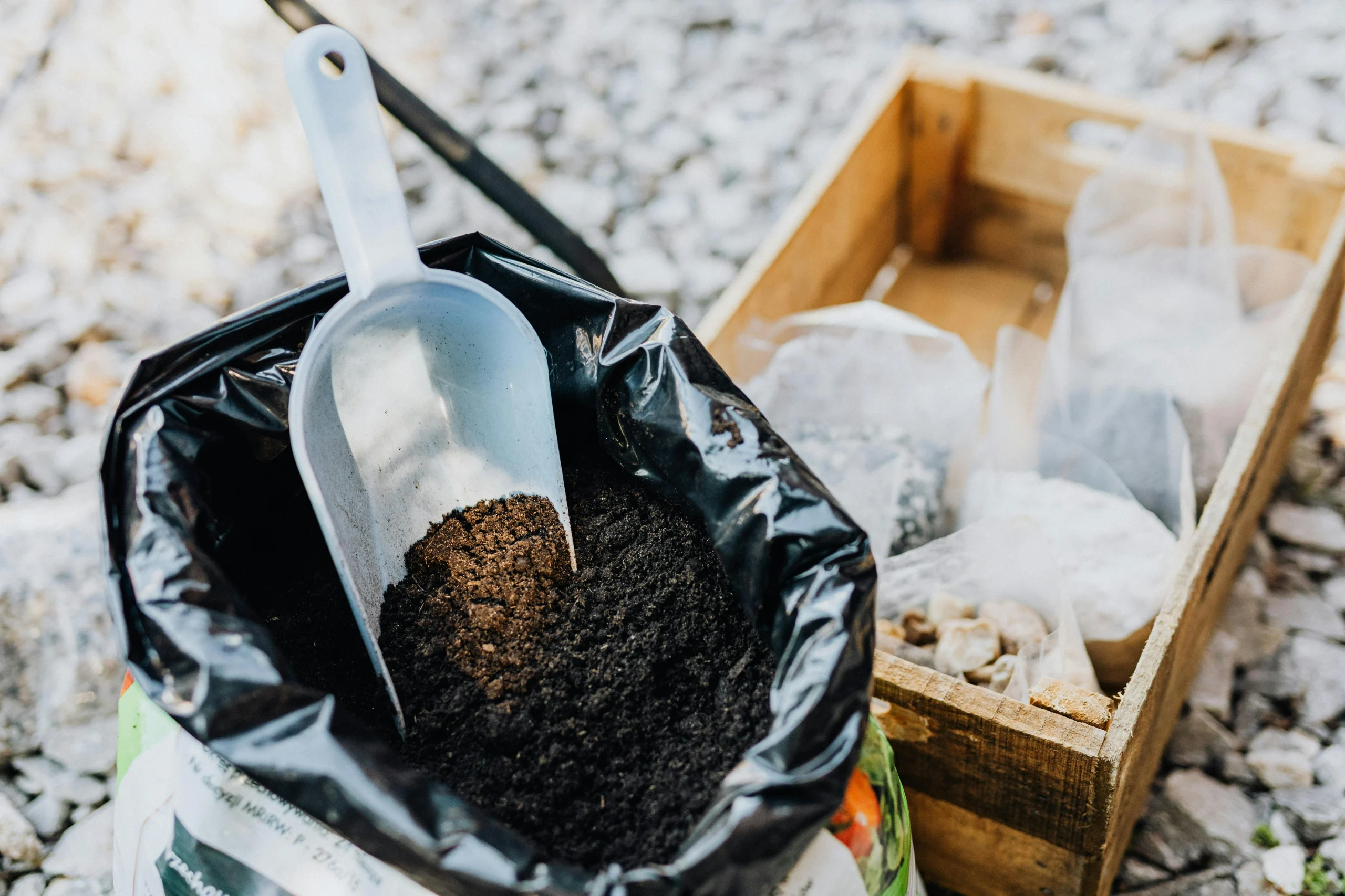 Soil tips for refreshing backyard garden soil between planting cycles with compost and cleared beds