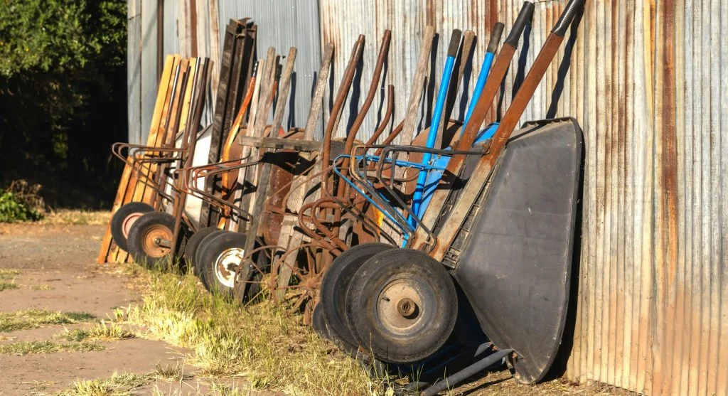 Garden tool kit with rake, shovel, and watering can