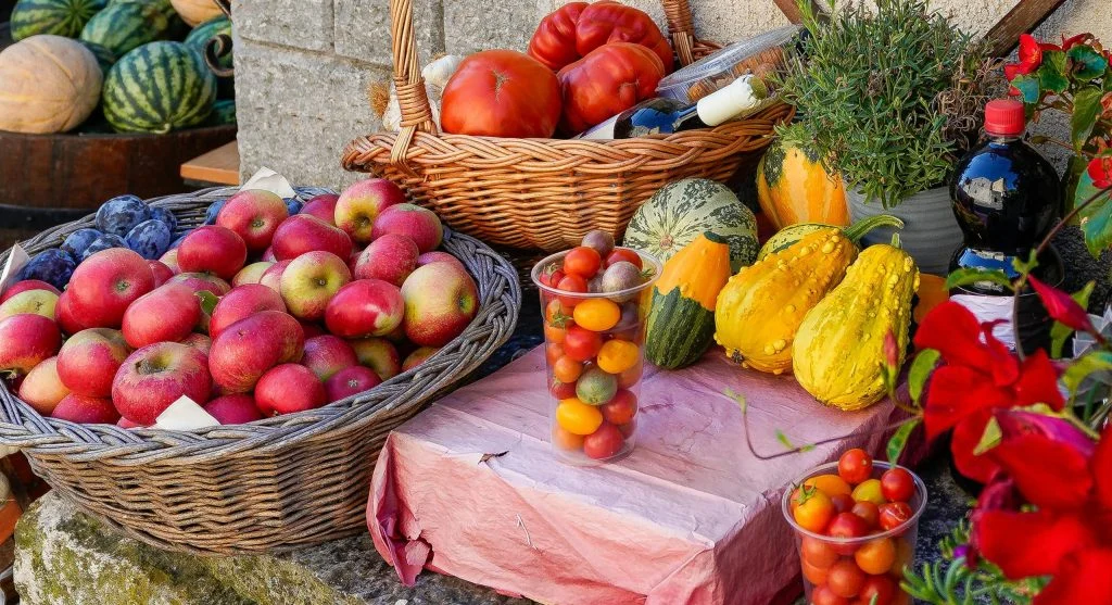 Harvest tips for sorting mixed-ripeness garden produce into separate baskets by use timing